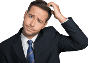 A businessman scratching his head, representing the complexity and confusion often associated with insurance policies.